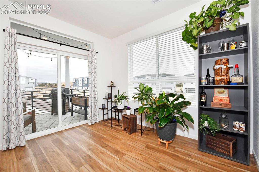 Sitting room with light wood finished floors and baseboards