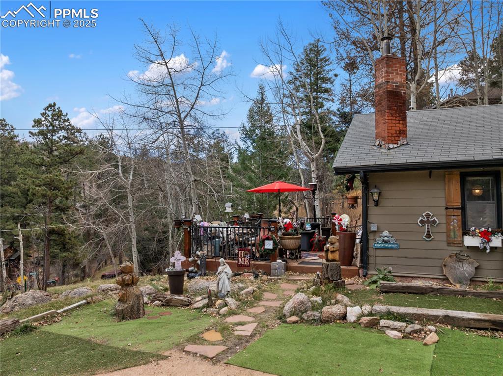 View of the upper wooden deck and side of building