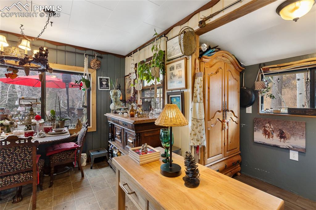 Dining area with wood walls