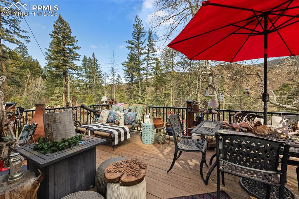 Deck with outdoor dining area and an outdoor living space