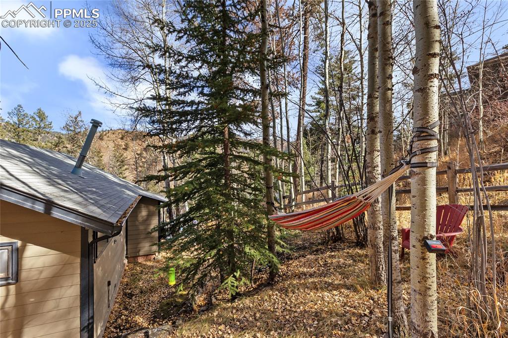 View of yard, side of building and outdoor seating