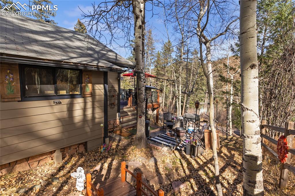 View of yard featuring a wooden deck