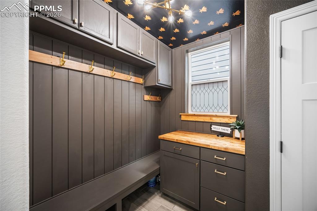 Mudroom with a shiplap textured wall