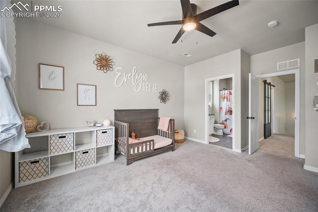 Bedroom featuring carpet, , and baseboards
