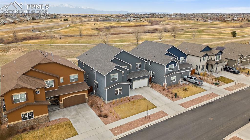 Birds eye view of property featuring golf course and pikes peak view