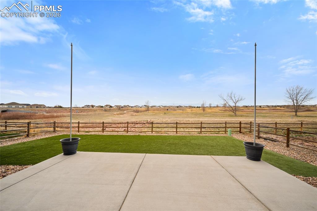 View of patio / terrace with golf course and pikes peak mountain view