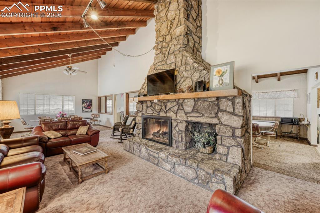 Clubhouse for residents features plenty of seating and a cozy fireplace