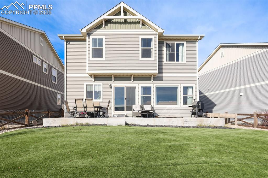 Rear view of property with a patio area
