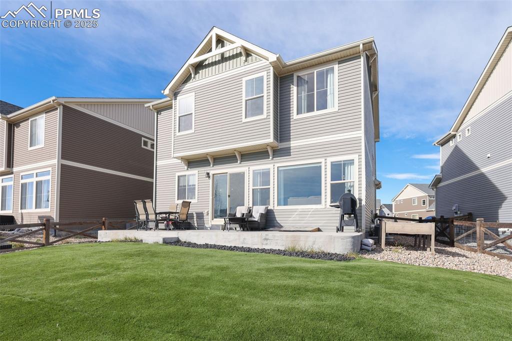 Rear view of house featuring a patio area