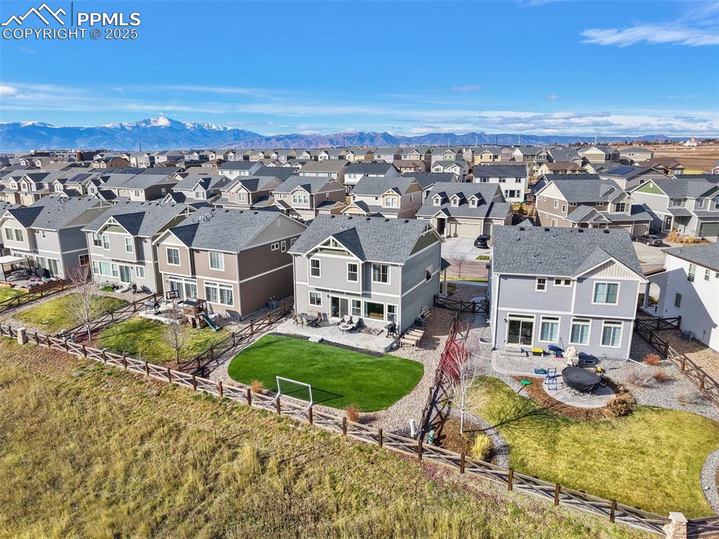 Aerial view of residential area featuring mountains