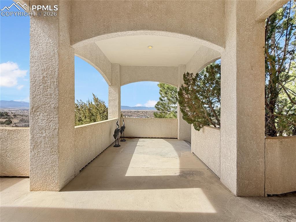 Beautiful formal dining area with bay windows and fireplace as well as an entrance to the balcony