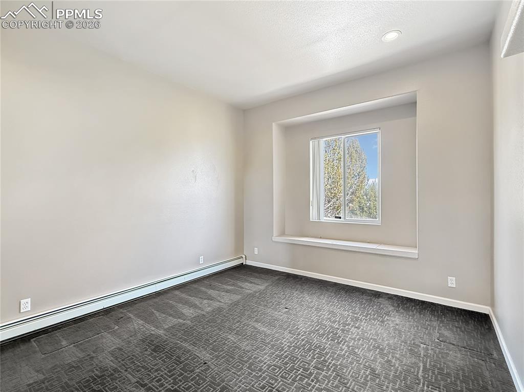 Dual shower heads and a sitting area, spa like