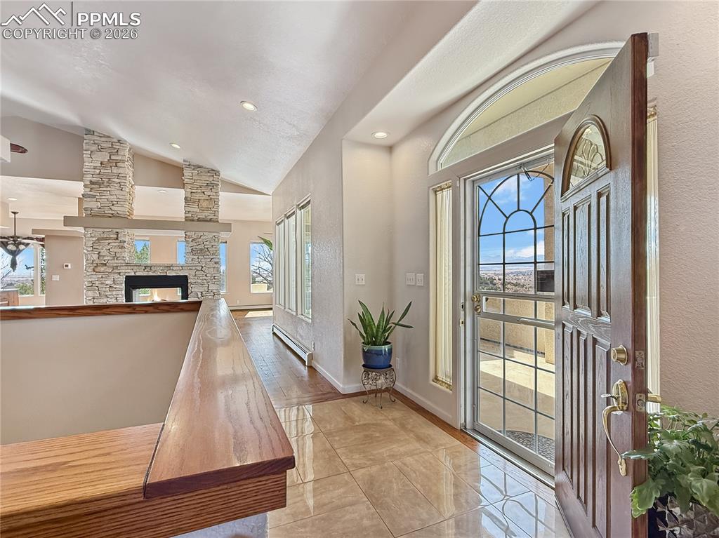 Right to kitchen/dining/living area, left to bedrooms or down to basement