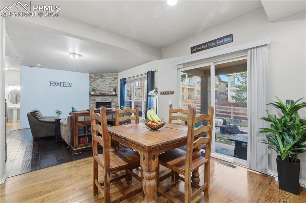 This sliding glass door opens to the back yard and opens automatically with the two included remotes or with the two sensors available for pet collars. You'll never have to get up to let the pets out again! 