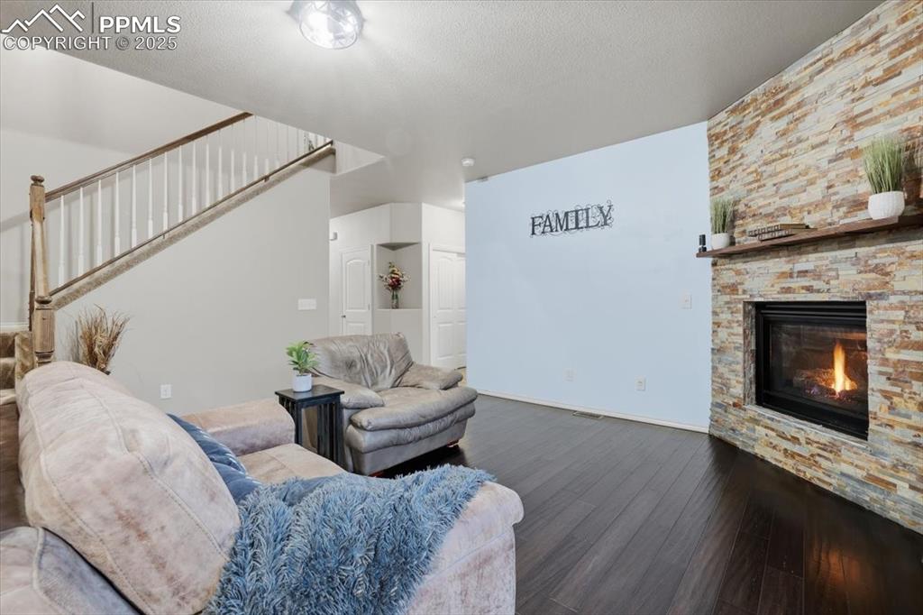 The hallway beyond the living area leads to the half bath and private office. 