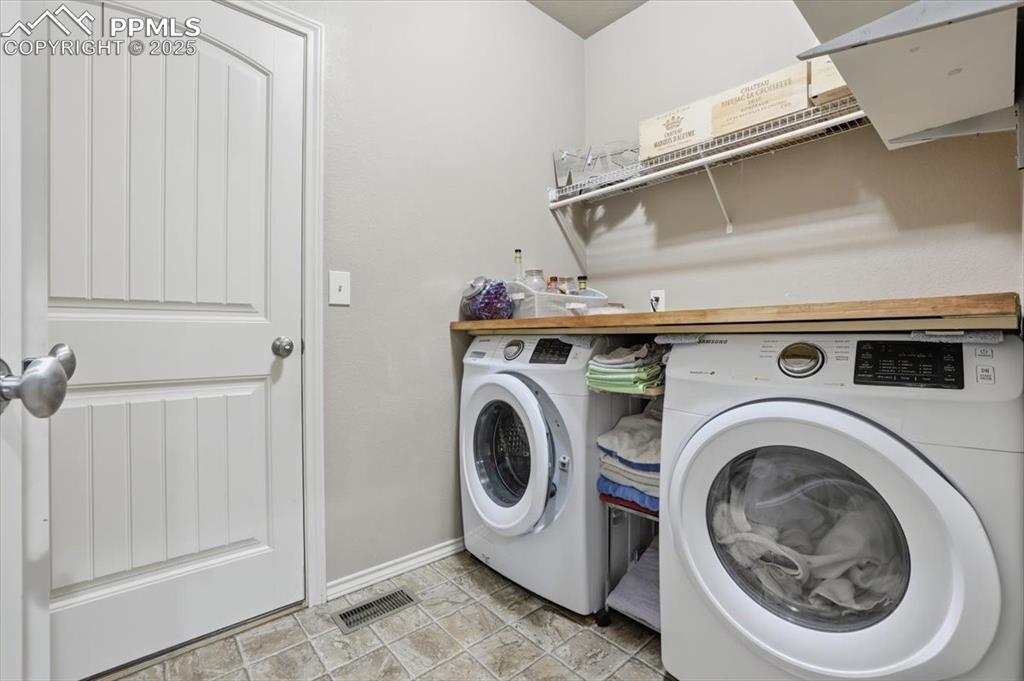 The main-floor laundry is located between the kitchen and the garage. 