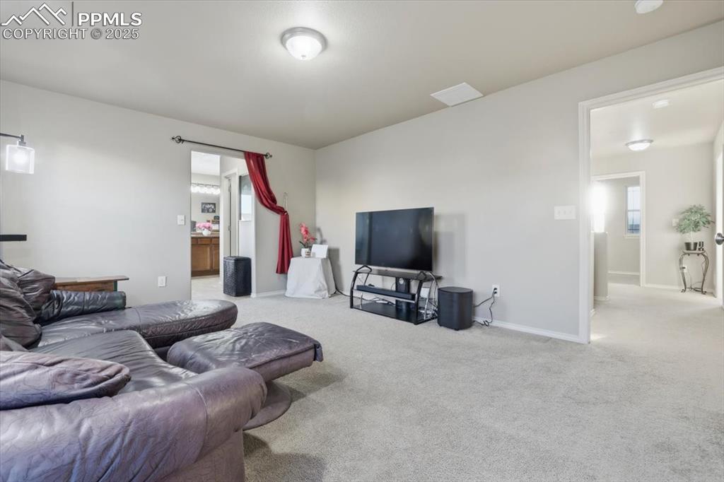 The primary bedroom is currently in use as a family TV area but it is HUGE and has plenty of room for a king-sized bed and all your furnishings. 