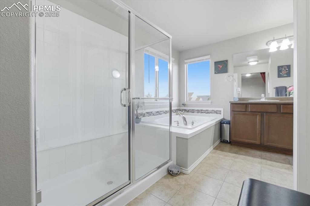 The primary bathroom is spacious and filled with natural light.