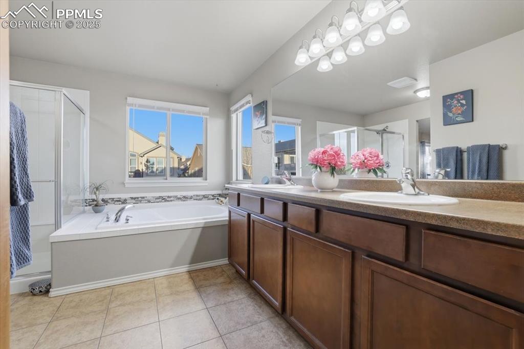 Dual vanities and LOTS of counter space make this an easy spot for two people to start and end the day together. 