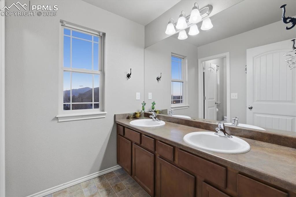 This second upper-level bath also has dual vanities and plenty of counter space. 