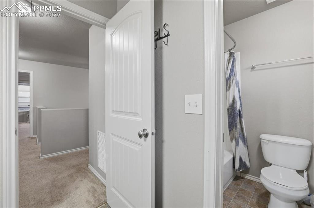 The second upper level bathroom has a tub/shower combo and serves the second and third upper bedrooms. It has dual sinks as well. 