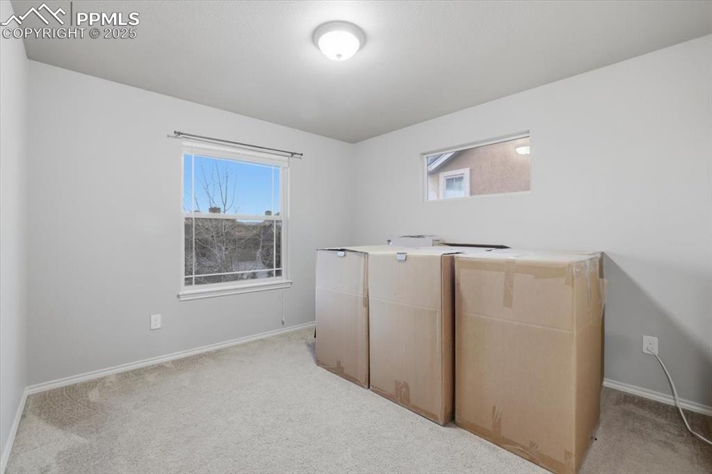 The third upper bedroom has big windows for natural light. The sellers are packing up - time to make this home YOURS! 