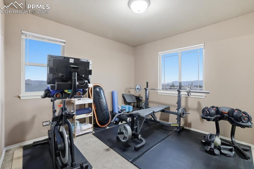 The fourth upper level bedroom is currently in use as an exercise room. 