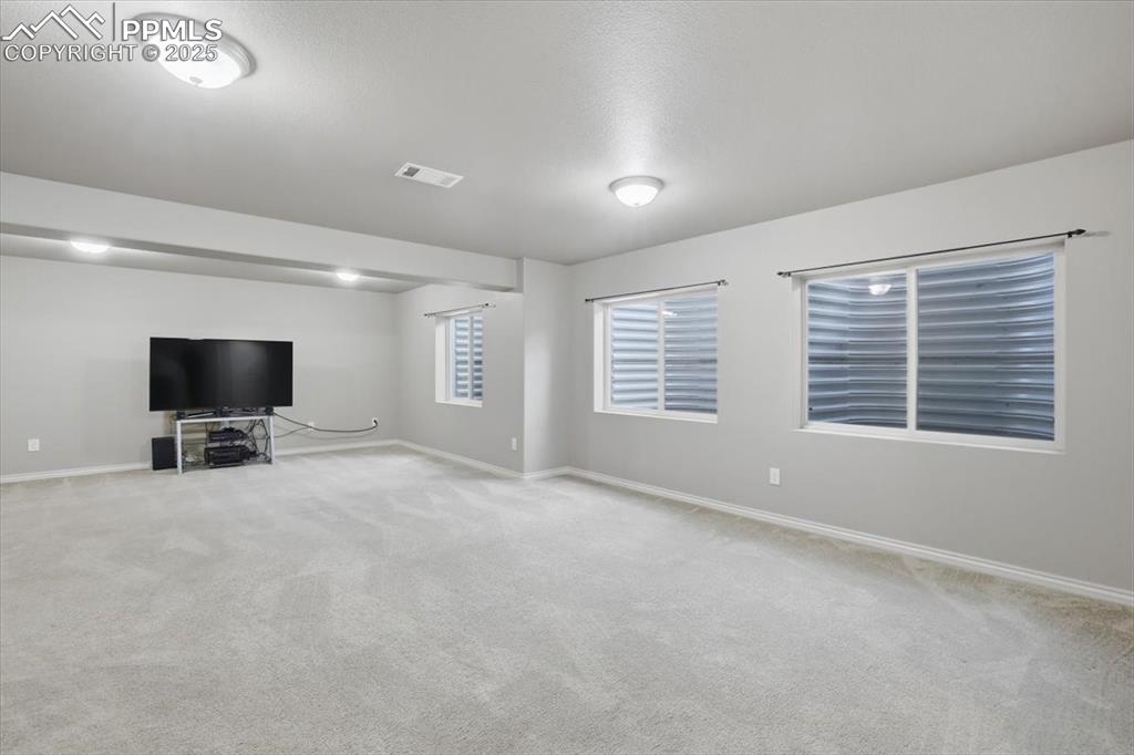 The basement level family room gets lots of natural light from the large windows. 