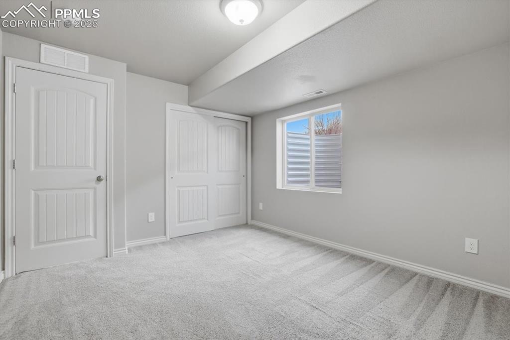The basement-level bedroom is bright and spacious.