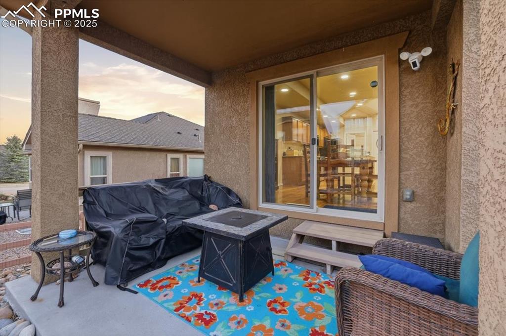 The covered patio is the perfect spot to unwind at the end of the day. 