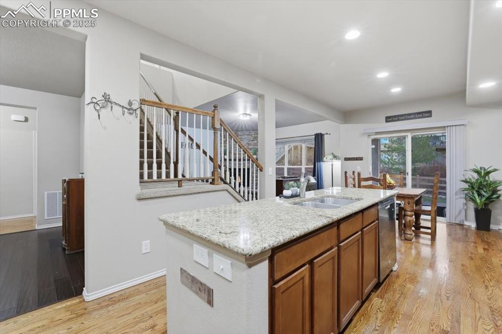 The kitchen is open to the formal dining room, informal dining area and living room. 