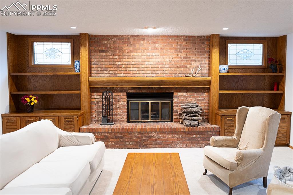 Built ins surround the fireplace.