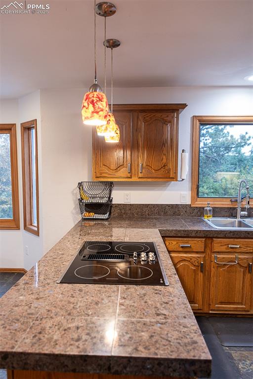 Pendant lights over breakfast bar.