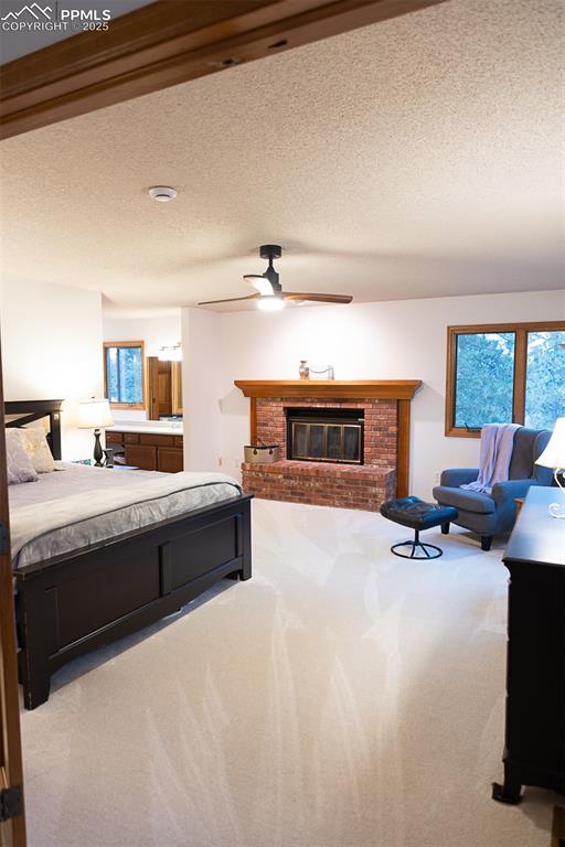 Large primary bedroom with fireplace.