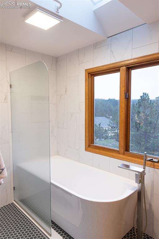 Freestanding new tub in primary bathroom.