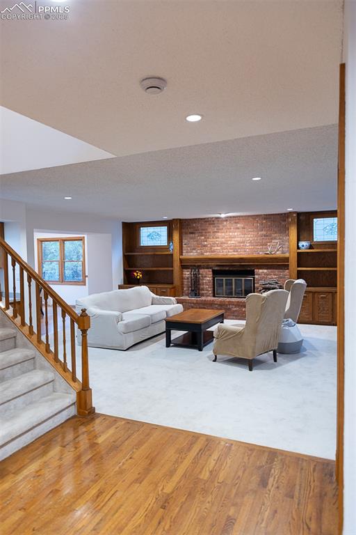 Living room with a wood burning fireplace.