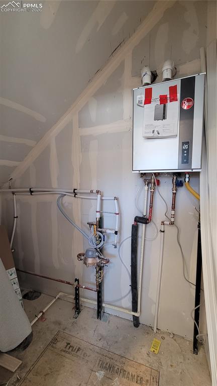 Main Level Mechanical Room Closet with Tankless Water Heater, and Crawl Space Access.