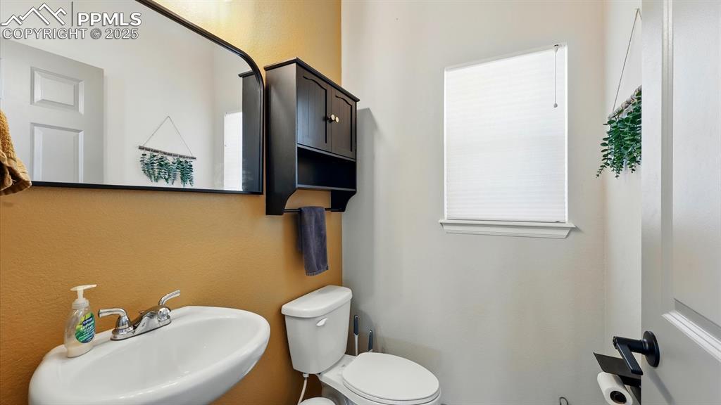 Powder Bathroom with pedestal sink.