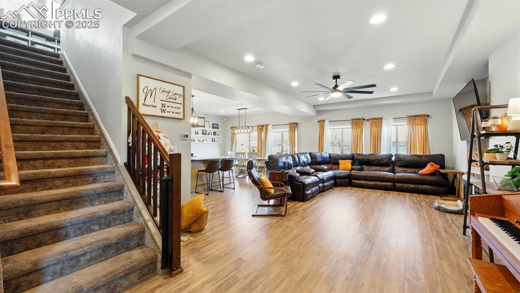 Entry into the Living Room, Dining Room, and Kitchen with stairs to the upper level.