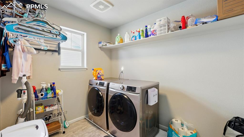 The Laundry Room includes a built in shelf, window, and washer and dryer.