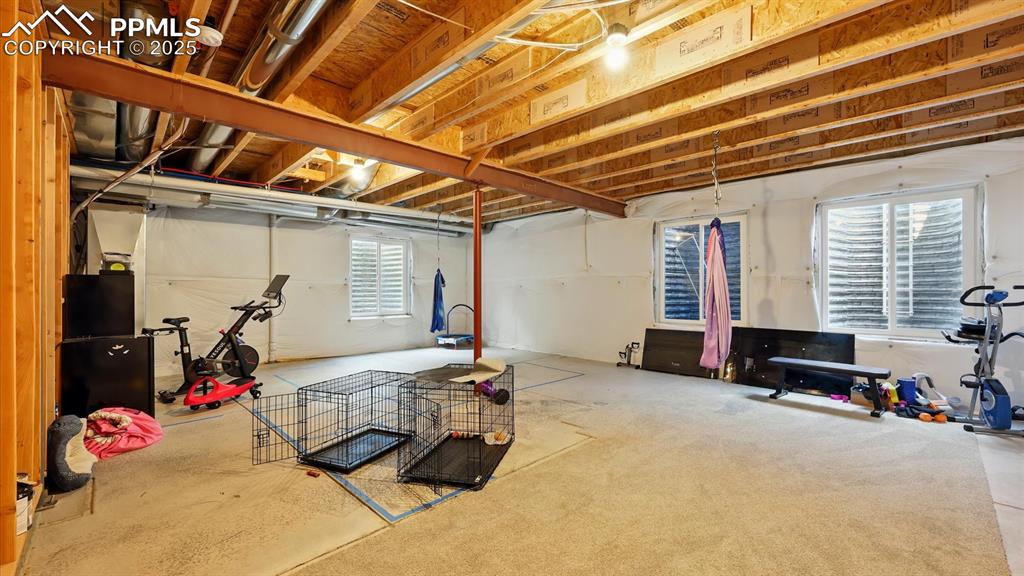 Additional flexible living space in the unfinished basement.