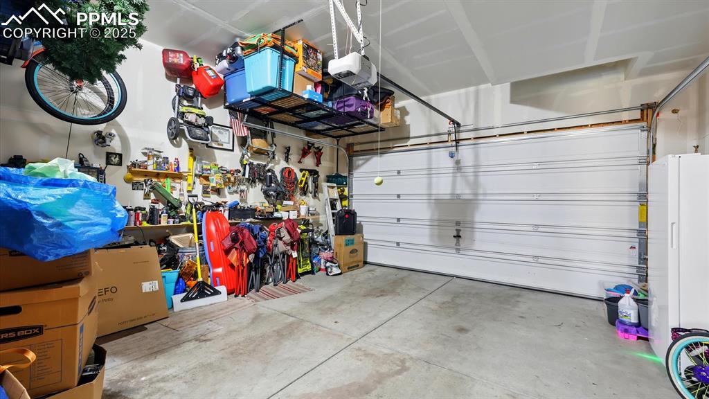2 car attached garage with door opener and built in storage.