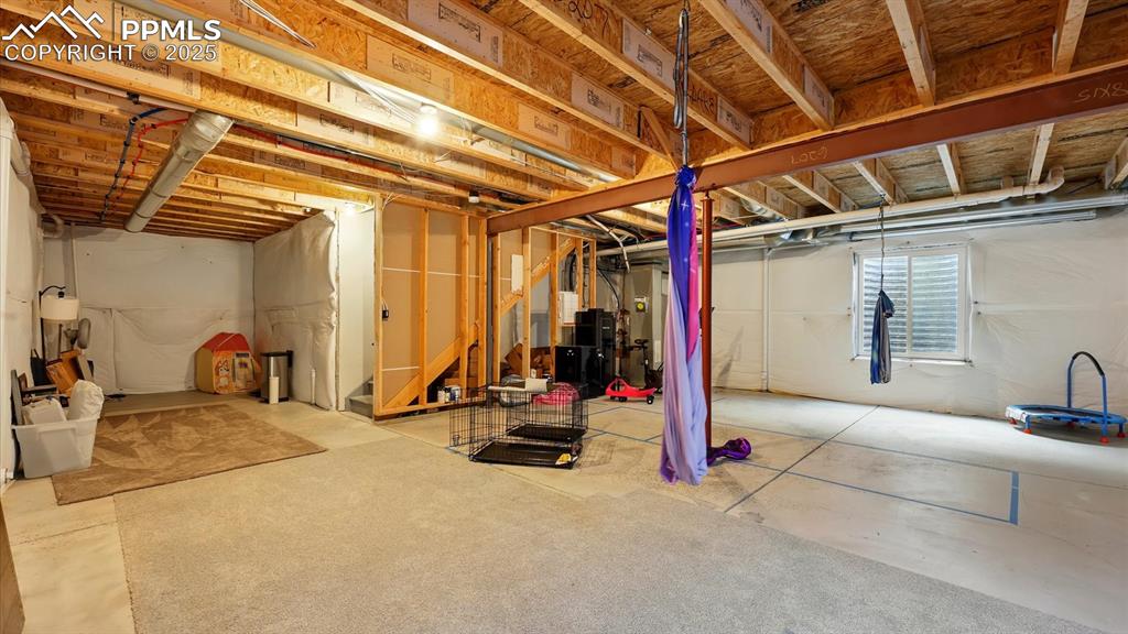 Unfinished Basement with 920 sf of unused space available for expansion.