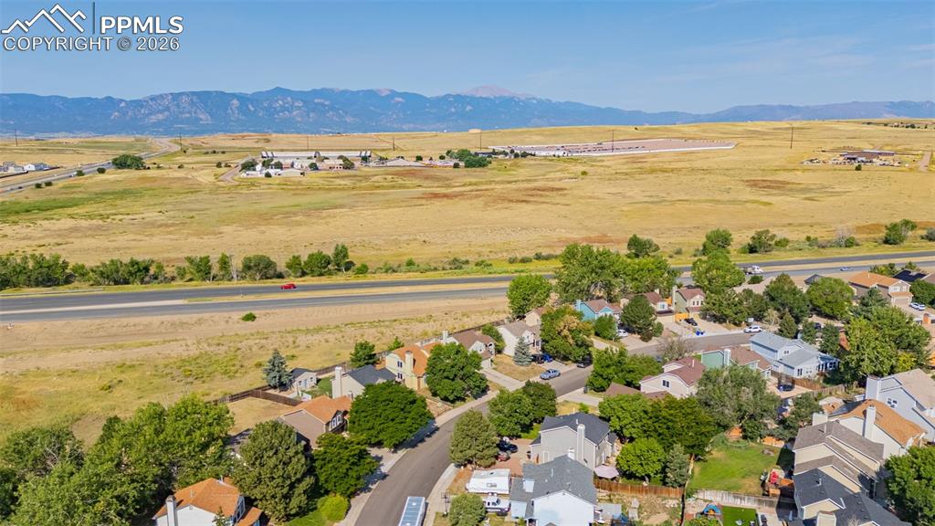 Aerial view of sparsely populated area featuring nearby suburban area
