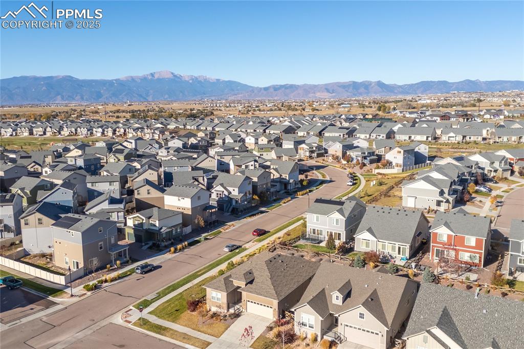 Aerial view of residential area featuring a mountain backdrop