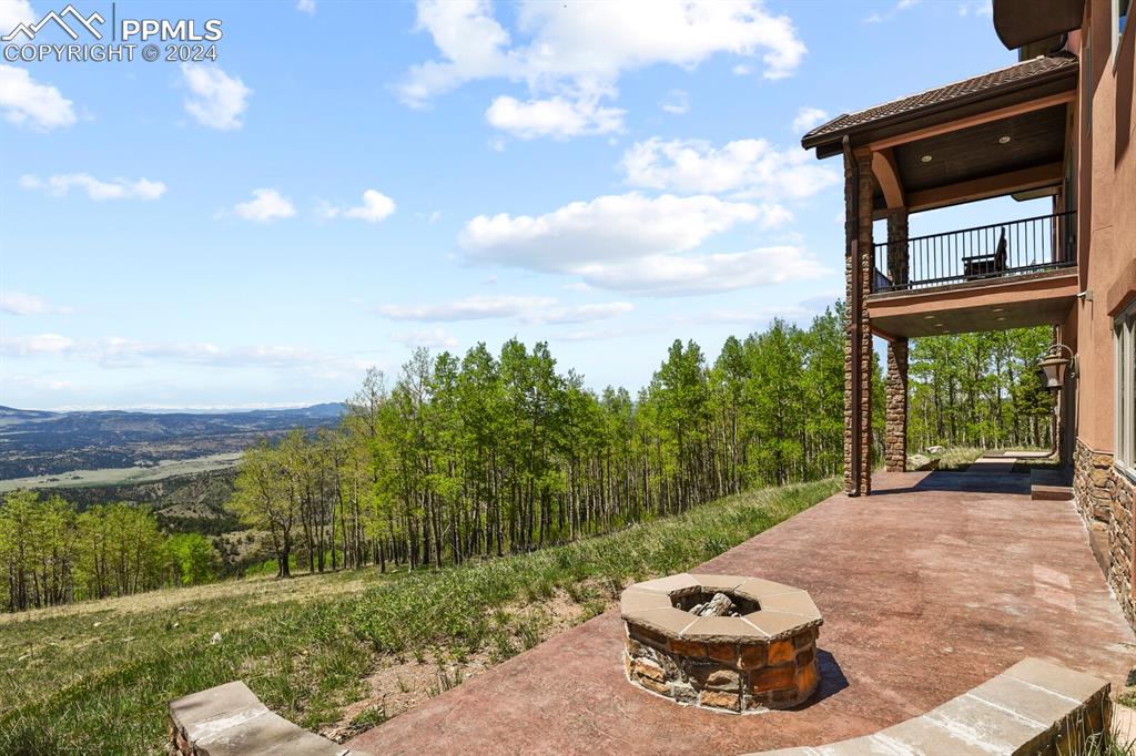 View of patio featuring an outdoor fire pit