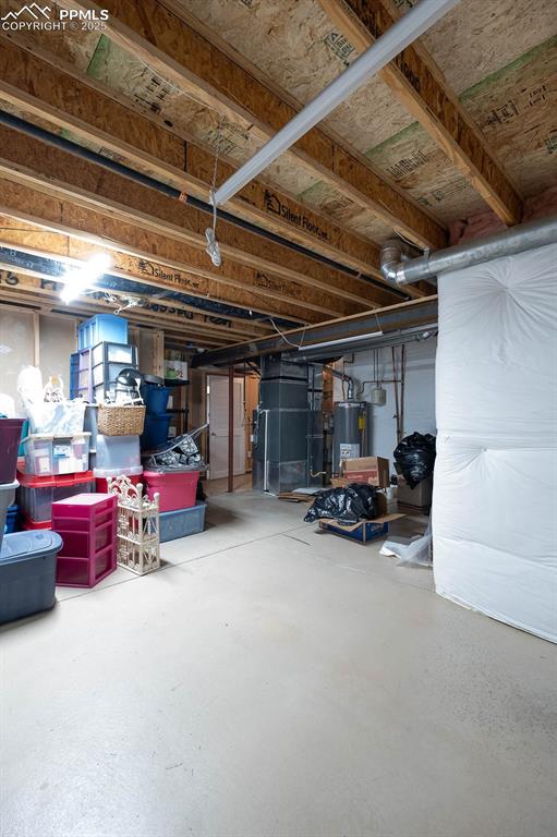 Unfinished area in the basement has a door.