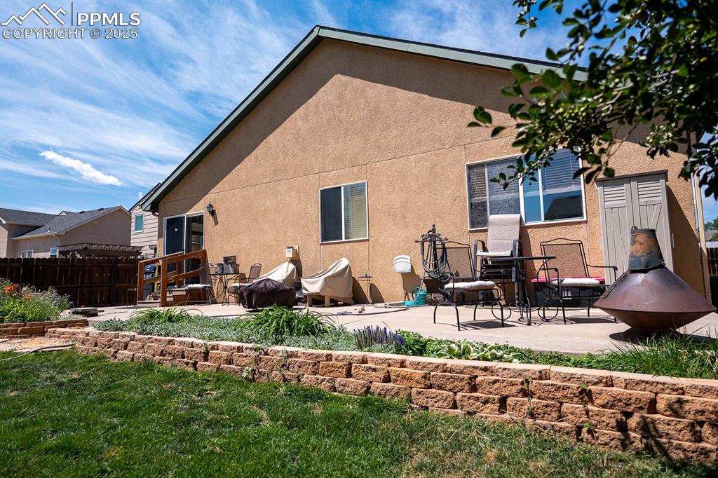 Large patio for furniture and a grill.