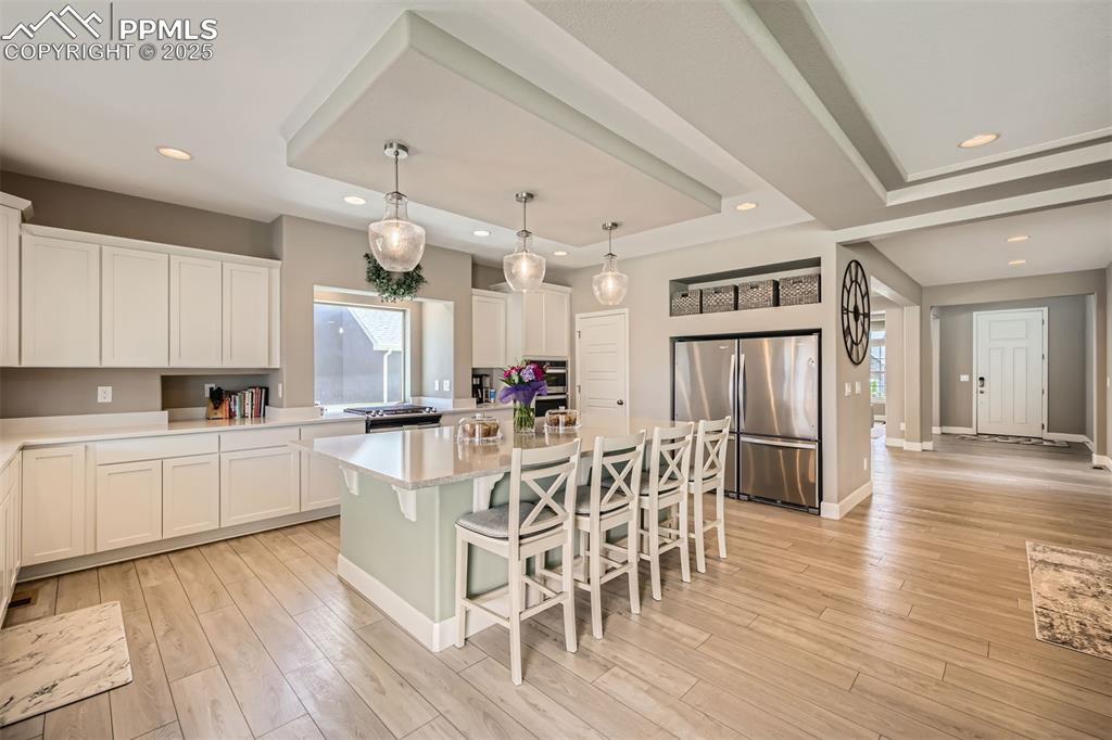 Walk in pantry in addition to massive storage, breathtaking quartz counters, gas range and double oven