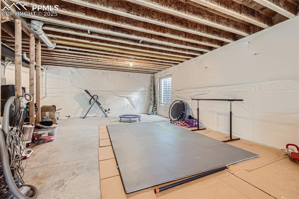 Massive unfinished basement has 9' ceilings and is pre-plumbed for a bathroom
